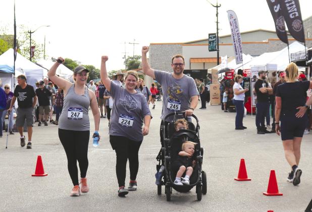 It was a family affair as 5k walkers Amy Maldonado, Whitney Adams, and Aaron Olson crossed the finish line of the YMCA Burnet Bluebonnet 5K/10K, Senior 2K and Kids Fun Run Saturday morning April 13. Photos by Martelle Luedecke/Luedecke Photography