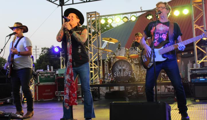 Suede, from left, Christopher Skiles, Robert Wagner, Danny Swinney with Chris Skiles on drums perform a lively program before hundreds during the Jackson Jam July 15 in Burnet at the courthouse square. 