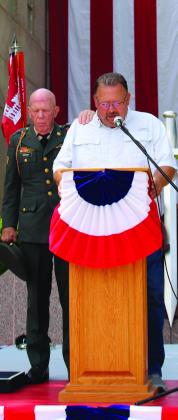 Chapel of the Hills Baptist Church Pastor Steve Leftwich offers a prayer during the Memorial Day ceremony May 29 in Burnet at the Courthouse Square.