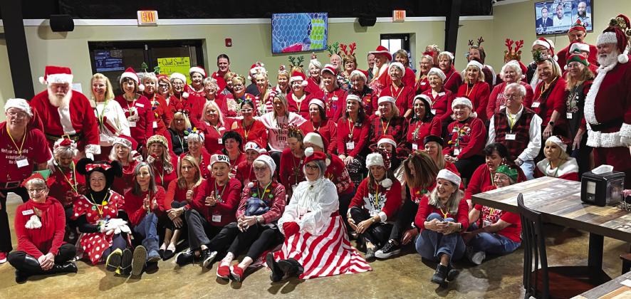 It took a village of volunteers to support the Highland Lakes Service League annual Special Needs Christmas party held recently at Putters and Gutters in Marble Falls. Pictured are all the members, helpers, and staff who made this amazing event possible. Contributed photo