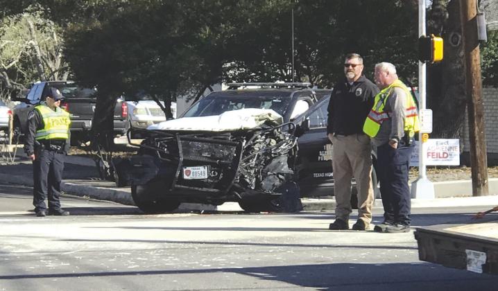 Several Burnet police department officers responded to manage a traffic accident between one Department of Public Safety vehicle and one commercial utility truck March 1 at Pierce Street and Texas 29. Jan Buechler/Bulletin