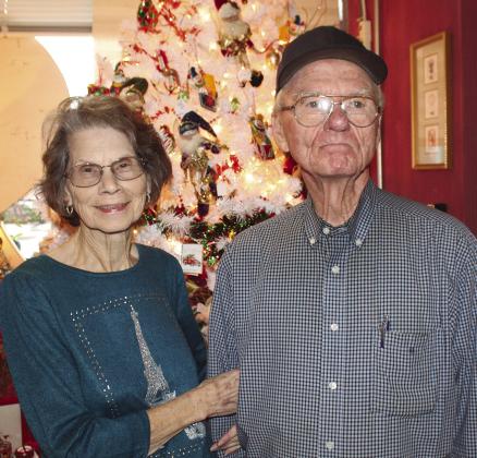 Bonnie and Ray Lawrence stand ready to host locals and visitors in the CaroLees shop near Burnet County Courthouse during the busy holiday season. Find more photos of the Lighting of the Square on Page 14. Photos by Raymond V. Whelan/Bulletin