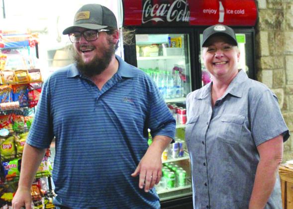 Maintenance crew member Ramsey Berry and Food and Beverage Manager Julie Deffenderfer enjoyed a light moment recently in Burnet at the city-owned Delaware Springs Golf Course. Raymond V.Whelan/Bulletin