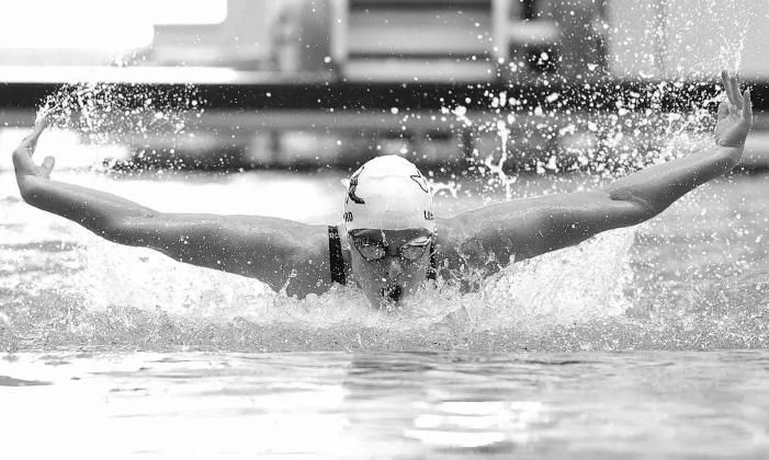 Burnet senior swimmer, Isabel Lunsford, slices through the water during her 100 Fly race at State. Lunsford earned two State silver medals in her final races for Burnet. Photos by Wayne Craig/Clear Memories