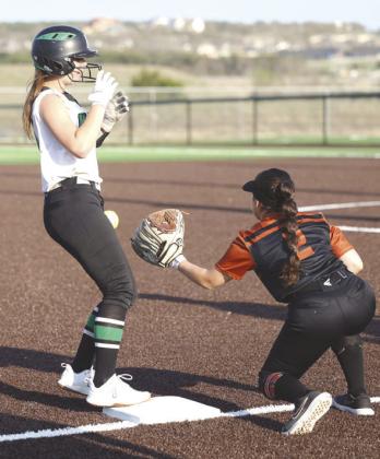 JV Lady Dawg Kendall Winkley reaches third base successfully after stealing two bases on an attempted throwdown at first. The JV girls finished the week 3-2-1.