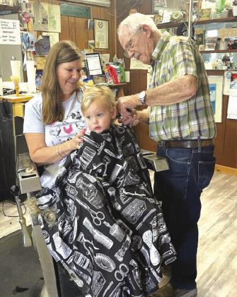Bandi Rountree took her grandson Clinton Samuel Rountree for a haircut recently and appreciated how many generations of the family had received their cuts from the same Barber, Tom Hullum, over the years. Contributed photo