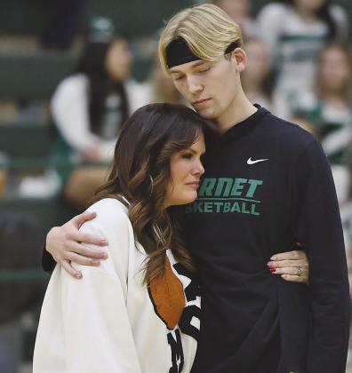 Emotions filled the air at Tuesday’s senior night activities before Burnet’s final regular season basketball game. Above, mom Ashlee Krause holds on tight to her senior son Garner Krause. Photos by Wayne Craig/Clear Memories