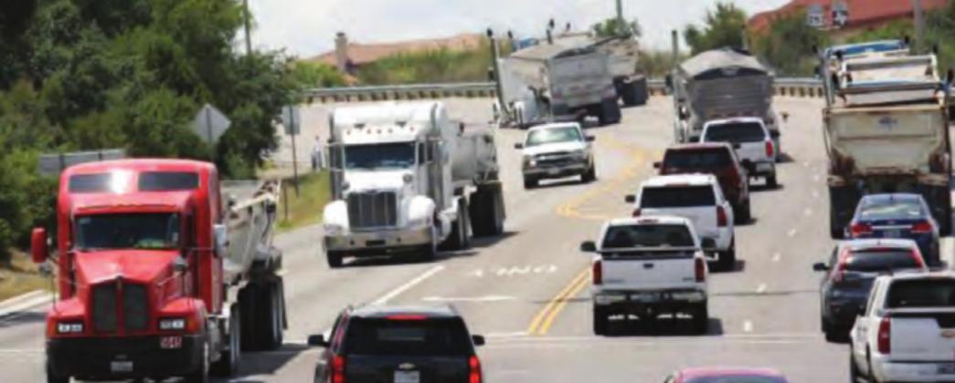 Large commercial trucks make their way through the main roadways in Burnet County daily. The state AG’s office was asked by local officials for an opinion about potential penalties for those that violate weight limit requirements on county roads. File photo