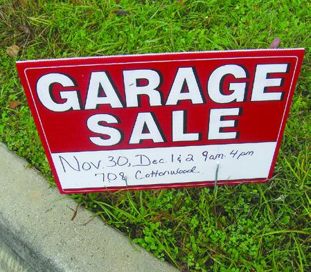 One typical garage sale sign appeared recently in Burnet near Hill Street. Raymond V. Whelan/ Bulletin