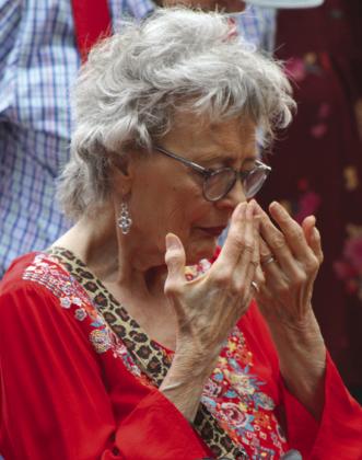Raymond V. Whelan/Bulletin Burnet resident Celeste Pogue bows in prayer May 4 during the National Day of Prayer service in Burnet at the County Courthouse.