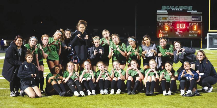 The Lady Dawg varsity soccer team moved to 6-0 in District 25-4A last Tuesday with a 5-3 victory over Marble Falls. The win gave Burnet sole possession of first place. Photos by Wayne Craig/Clear Memories