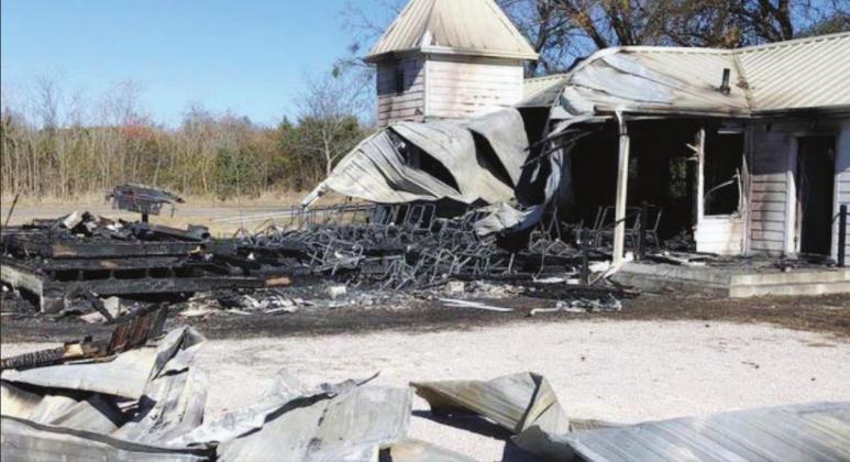 A fire believed to be an arson destroyed the unoccupied Mahomet Christian Church (left) Dec. 9, joining the list of other locations such as an auction barn (above) targeted by suspects this year. File photos
