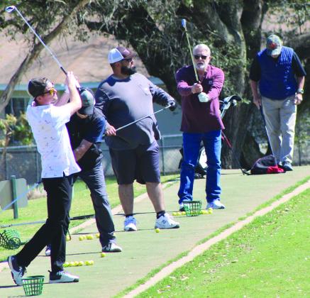 Several unnamed golfers tuned up their swing at the Delaware Springs Golf Course practice range last Friday. Raymond V. Whelan/Bulletin