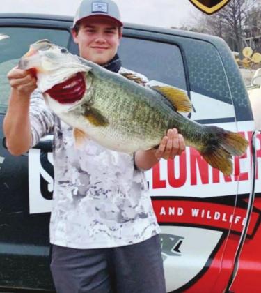 Young angler Trace Jansen set a new waterbody record for Lake Travis with this 15.32lbs ShareLunker in 2021. The season is open to all fishers and assists Texas Parks and Wildlife researchers. Contributed/TPWD
