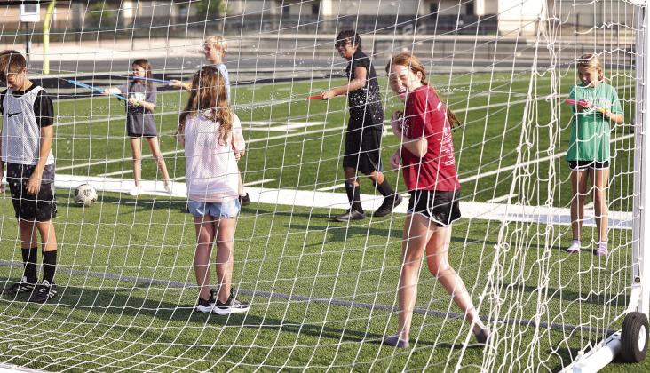 Burnet’s soccer campers found a fun way to beat the heat on the turf field last week with water wands. Teams took turns spraying their opponents after scoring a goal during scrimmage play. Photos by Wayne Craig/Clear Memories