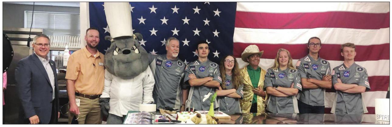 Burnet High School was abuzz with excitement as the Space Dawgs were named winners of the 2021 NASA HUNCH culinary competition on Monday, May 10. Pictured from left are BCISD superintendent Keith McBurnett, BHS principal Casey Burkhart, Barney Bulldog, culinary arts teacher Chef Mike Erickson, Matthew Thrane, Bridget Bristow, BCISD board member Robby Robertson, Jacey Huston, Nicholai Rowland and Will Rundzieher. Contributed/BCISD