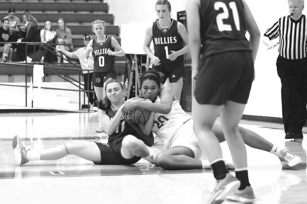 Lady Bulldog post, Zaria Solis, goes to battle with Fredericksburg’s Minot Frantzen for a loose ball during the girls’ Thanksgiving break game on Tuesday. Photos by Wayne Craig/Clear Memories