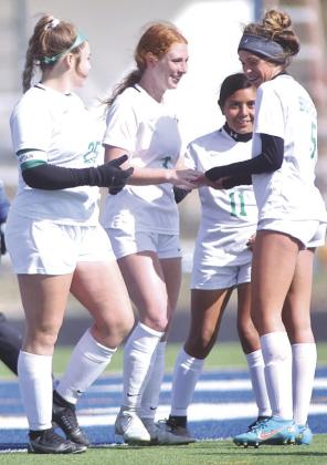 The Lady Dawg soccer team moved to 5-0 in district play last week. Pictured above Lainey Rye, Amelia Griffin, Ariana Chavez, and Brook Oliva celebrate after a goal.