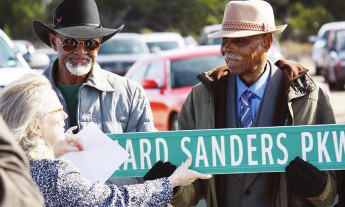 Former Burnet City Councilman Richard Sanders, right, is honored by Mayor Crista Goble Bromley with a street dedication in his name on Dec. 12, 2019, at the site of what is now the Baylor Scott and White complex across from the Burnet County Sheriff’s Office. Sanders passed away Thursday, Aug. 27, at the age of 95. File photo