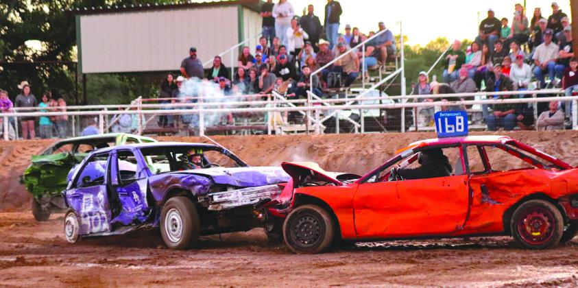 Shannon Dyer, winner of the bare bones smash up, rams the last remaining car to achieve her victory during the Burnet Demolition Derby Oct. 14 at the county fairgrounds.