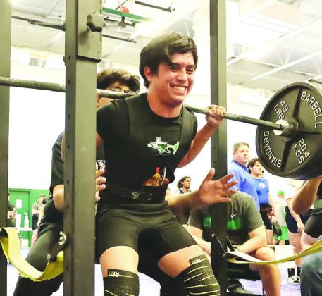 Photo by Wayne Craig/Clear Memories A smile emerges from the face of Jose Rodriguez as he pushes up a big squat at a recent meet. Rodriguez captured first in Lampasas with an 1,110 total.