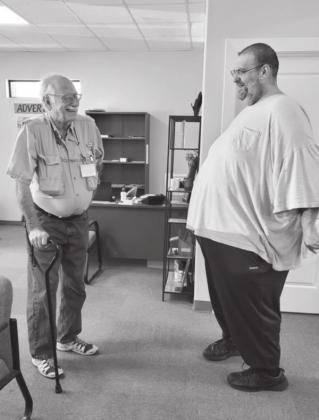 Outgoing Managing Editor Lew K. Cohn shared one final laugh with Bulletin contributing writer Phil Reynolds last week. Connie Swinney/Burnet Bulletin