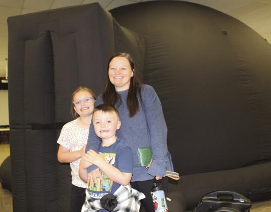 Ashley Gaston (standing) with her children McKinley (left) and Rocky attended the Austin Stars and Science program March 13 in Burnet at the AgriLife Extension. The Gaston family recently moved to Burnet from LaGrange. Raymond V. Whelan/Bulletin