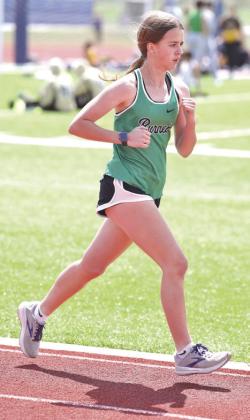 Lady Bulldog Shelby Hudgins guts it out for a first place finish in the grueling 3200 meter run.
