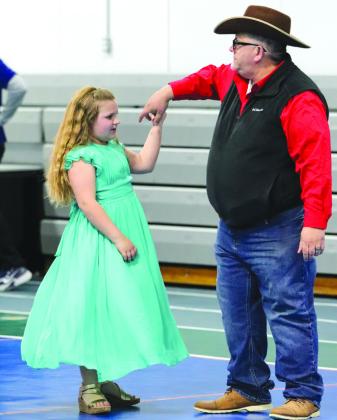 Brandon Evans spun his daughter Remi Grace at the DIVA Dawgs and Bulldog BROS Family Dance and Dodgeball held at the YMCA Feb. 18.