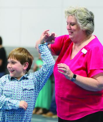 At right, Darlene Denton and her grandson Barrett Feller had a wonderful time Sunday Feb. 18 at the DIVA Dawgs and Bulldog BROS Family Dance and Dodgeball at the YMCA.