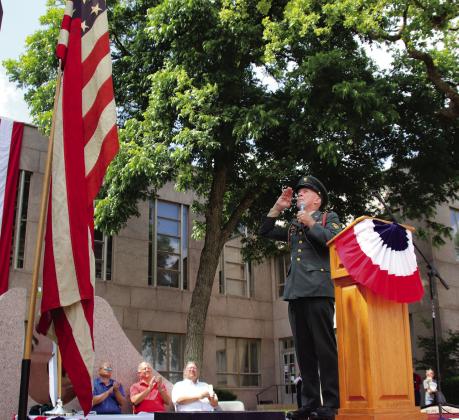Steve Anderson salutes the American Flag during his recitation of Johnny Cash’s “Old Rugged Flag” May 29 during the Memorial Day ceremony in Burnet at the County Courthouse.