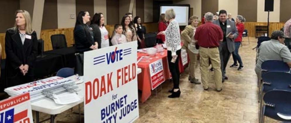 Prior to the start of the forum on Jan. 27, attendees talked with candidates at their respective exhibits at the Burnet Community Center. Photo by Jeff Shabram/The Highlander