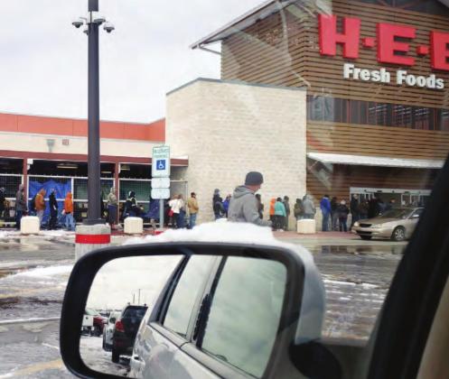 As sub-freezing temperatures persisted, a motorist lamented a line which formed outside the Marble Falls HEB on Tuesday, Feb. 16 as workers monitored the the number of customers coming into the store due to COVID-19 capacity limits imposed by the state. Contributed/Rick Cummings