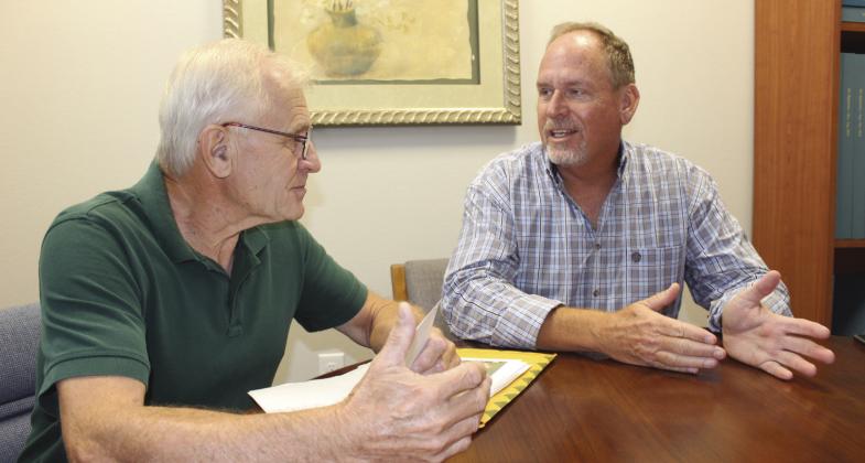 Theo Van Eeten, left, and Marty Galliart, officers in the Buchanan Lake Village Land Owners Association, discussed the impending lease fee hike on their LOA by the Lower Colorado River Authority. Connie Swinney/Bulletin