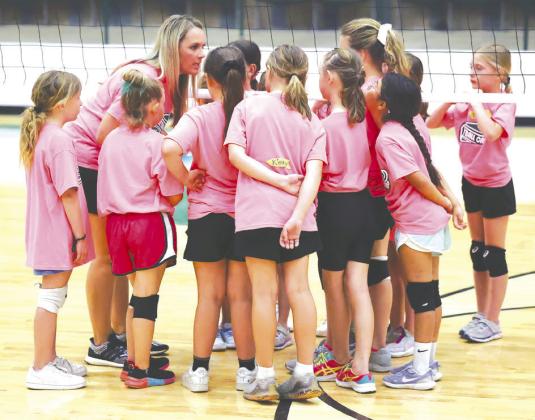 Burnet head volleyball coach, Crystal Shipley, gathers some of her campers for encouragement just before live scrimmage play on Wednesday. Photos by Wayne Craig/Clear Memories
