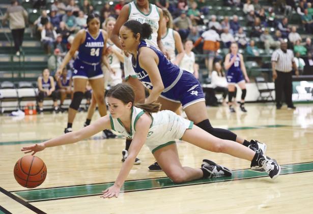 Senior Lady Bulldog, Grace Gates, stretches out for a loose ball during Friday night action versus Jarrell. Burnet won, 57-28. Photos by Wayne Craig/Clear Memories