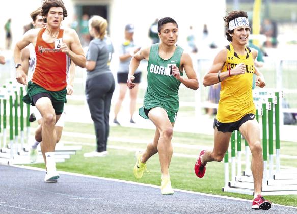 Burnet’s Victor Aviles does battle at the front of the pack in the boys mile. Aviles earned silver in the 800 and bronze in the 1600. Photos by Wayne Craig/Clear Memories