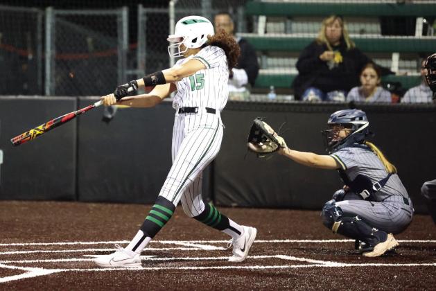 Varsity Lady Bulldog Elyse Dearcos finishes through her swing during Tuesday night’s game versus Canyon Lake. Dearcos had a fantastic week at the bat with three homeruns and three singles for the Lady Dawgs.