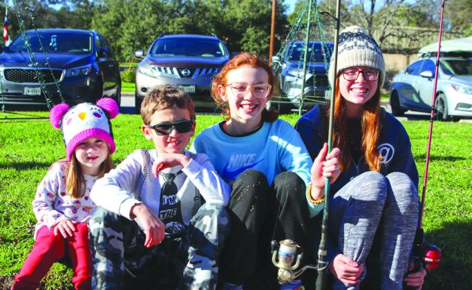 Thursday, Dec. 28, Mary Jane Partain, 4; Jesse Seissom, 8; Faith Seissom, 12; and Madison Montes, 14, arrived at Hamilton Creek Park with poles in hand for the Texas Parks and Wildlife Department Rainbow Trout release. Photos by Grace Gates/Luedecke Photography