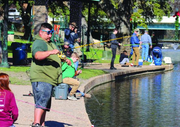 The banks of Hamilton Creek were lined with anglers Thursday, Dec. 28, for the Texas Parks and Wildlife Department rainbow trout release. Find more photos on Page 7.