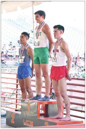 Burnet long-distance runner Hudson Bennett displays a big smile while standing atop of the awards podium with his newly earned golden state medal hanging around his neck. The Burnet tenth-grader edged out several senior runners for the top award in the 3200 meter race at the UIL State Meet on Thursday.