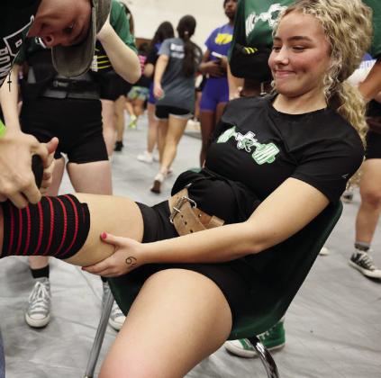 Gracie Farmer prepares for her squat with the assistance of Brady Rygaard who helped wrap knees for Burnet’s girls at Regionals. The Burnet boys powerlifting team is sending 10 lifters to compete at the upcoming Regional Meet. Those athletes include, front row, Andrew Hudgins, Tommy Butler, Alek Kassner, Brady Rygaard, and Adler Goehring. Back row, Luke Hudgins, Shane Ikonen, Johnny Charron, Jack VanAartsen, and Brandon Westbrook.