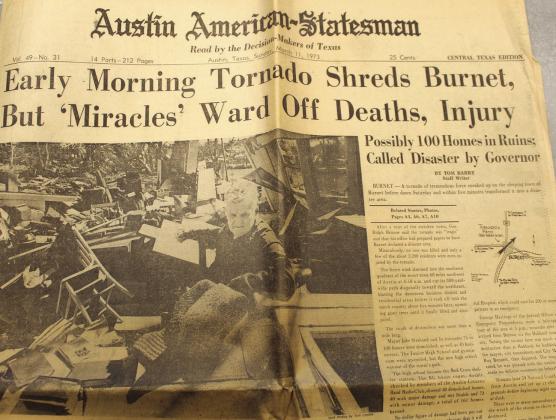 The Austin American-Statesman headline proclaims the disaster which struck Burnet March 10, 1973. The photo beneath depicts Burnet resident A.M. Gibbs in his home near Hamilton Creek Park, sifting through rubble caused by the storm. Contributed/AA-S/Tom Lankes