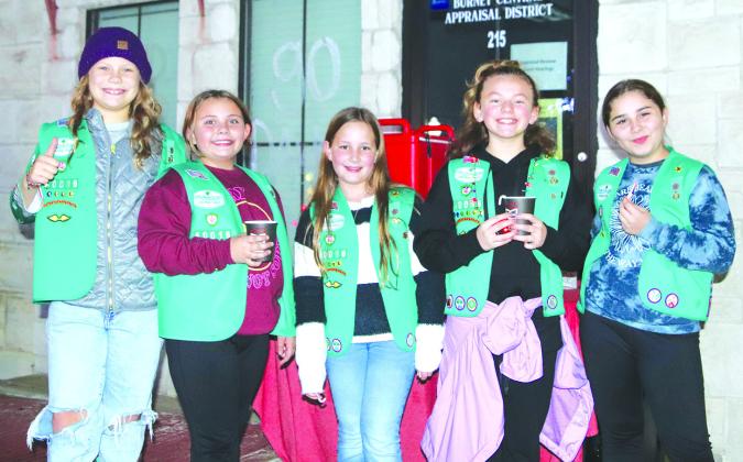 Rheid McFerrin, Krystian Taylor, Presley Steffan, Sofia Massey and Adylin Taylor of Girl Scout Troop 40016 served hot cocoa to attendees, during the Lighting of the Square at the Burnet County Courthouse on Nov. 25 in Burnet.