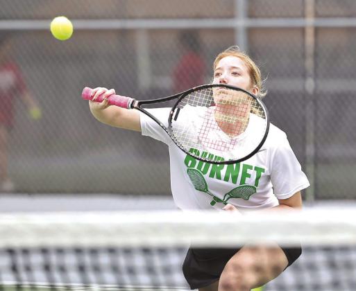 During doubles tournament play on Thursday in Burnet Lynzie Wilkes returns a volley for her team. All of Burnet’s tennis athletes earned a win at their host Invitational.