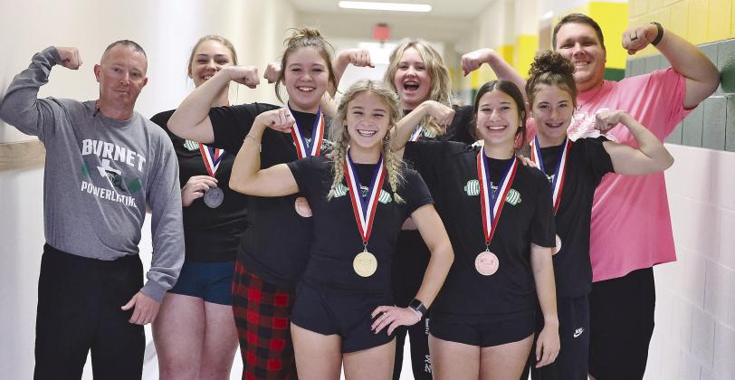 Photos by Wayne Craig/Clear Memories The Lady Bulldog powerlifters pictured above, Maddie Moise, Mady Cardenas, Abby Smith, Emmalee Williams, Hailee Beltran, and Josie Teague all earned regional medals on Friday. The girls are pictured with their coaches Trevor Couch and Tyler McIntosh.