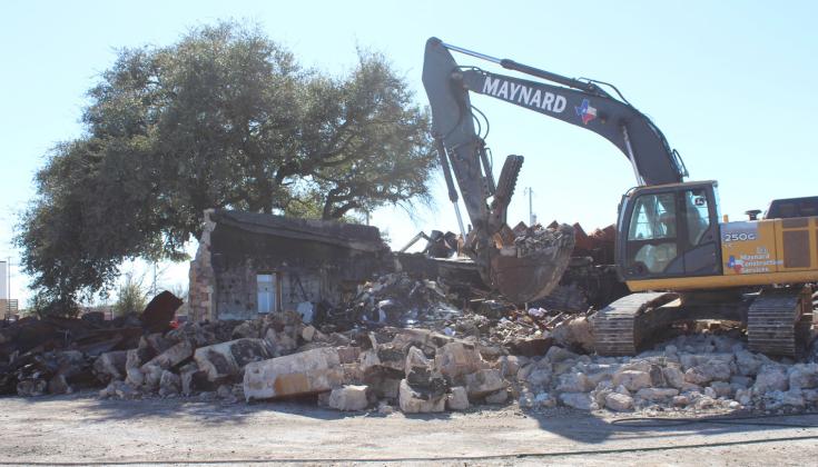 Maynard Construction Services conducted demolition of the former Reagor Air Conditioning, Heating, Plumbing and Electric building Feb. 19 in Burnet. Raymond V. Whelan/Bulletin