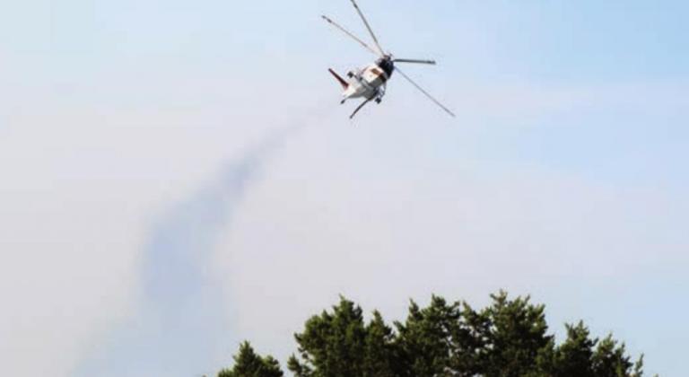 Service helicopter, like this one seen at the Trails fire in Horseshoe Bay, was used to battle the Lockhart Mountain blaze north of Llano. Lew K. Cohn/Burnet Bulletin A Texas A&amp;M Forest