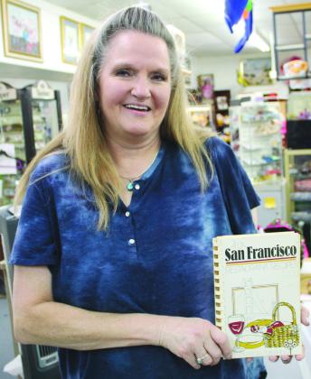 Photos by Raymond V. Whelan/Bulletin Sales Associate Tracy Patters recently sold one cookbook to an eager customer in Burnet at the S&amp;H Trading Post, 209 W. Polk St.