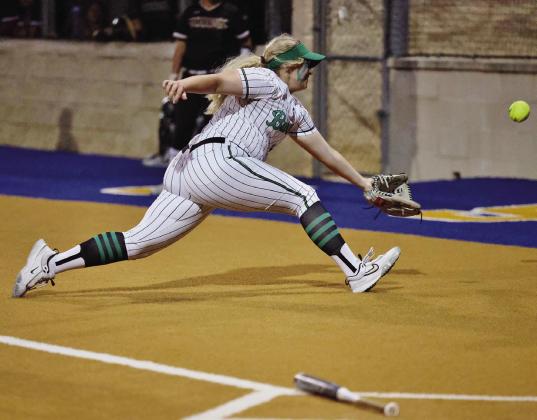 No lack of effort: Lady Dawg first baseman Carlee Williams covers some ground and makes a diving effort on a pop-up bunt. Williams and her teammates easily defeated Giddings, 13-1.